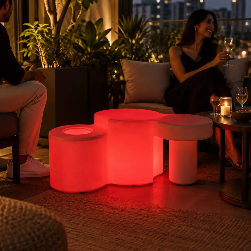 Celesta Illuminated Garden Bench — LED outdoor garden bench in White Stone glowing at dusk