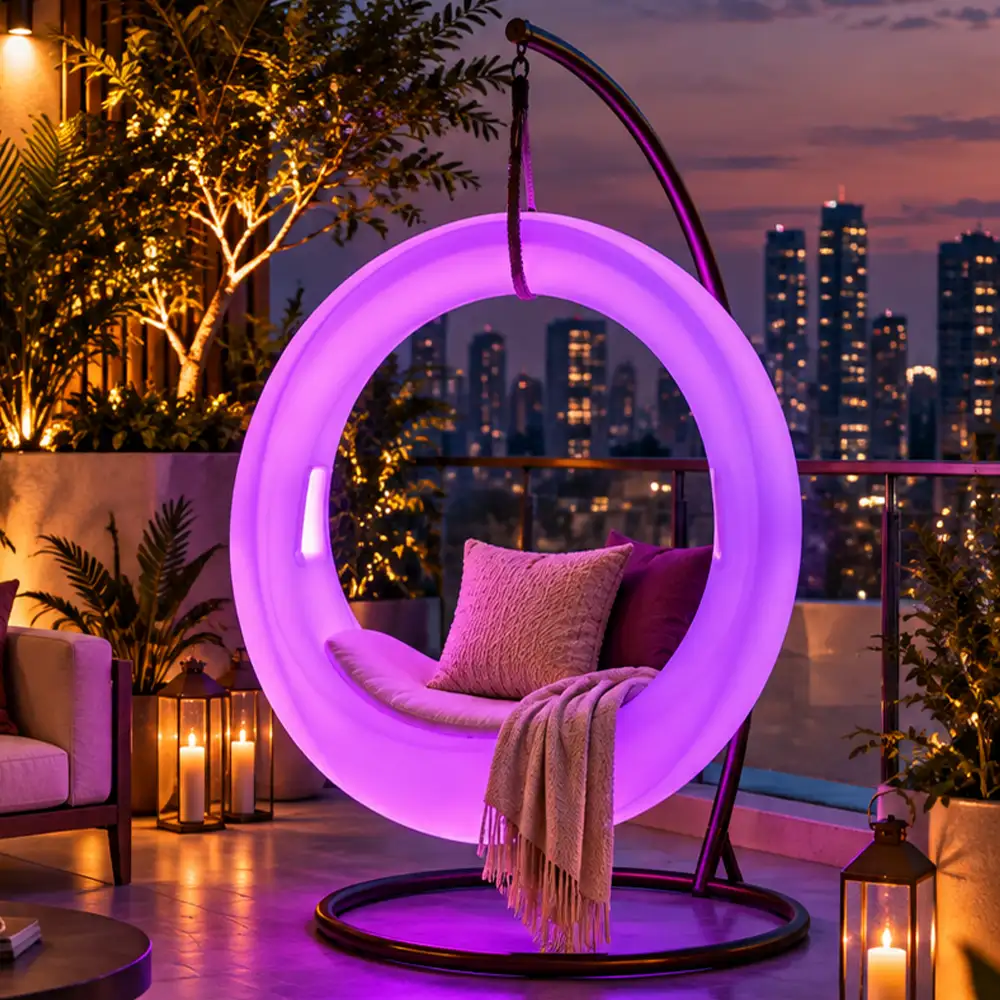 Milo Illuminated Garden Swing — LED outdoor swing in White Stone glowing in a garden at night