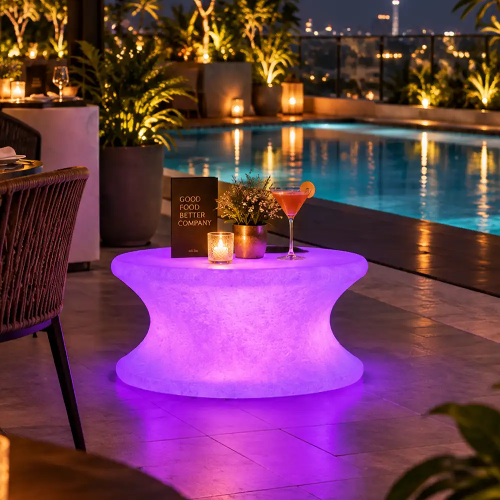 Olivia Illuminated Table — LED outdoor coffee table in White Stone glowing at night