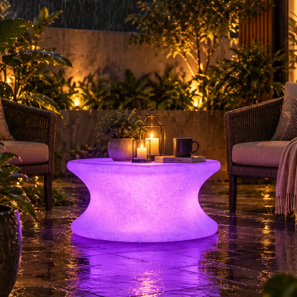 Olivia Illuminated Table — LED outdoor coffee table in White Stone glowing at night