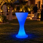 Sirocco Illuminated Bar Table, LED bar table in White Stone glowing on a rooftop terrace