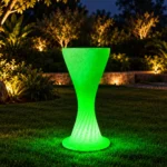 Sirocco Illuminated Bar Table, LED bar table in White Stone glowing on a rooftop terrace